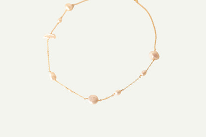 Asymmetrical pearl necklace