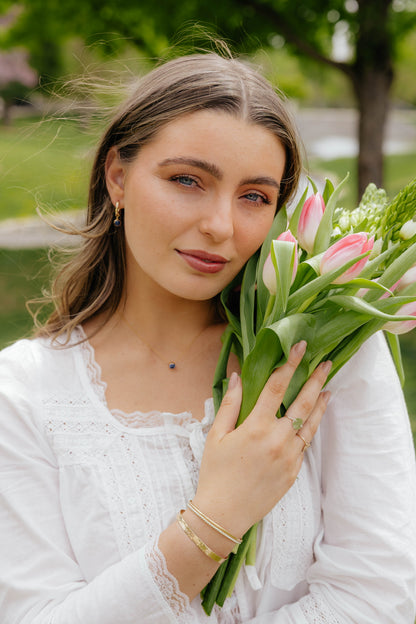 Woman holding tulips syd squaredjewelry